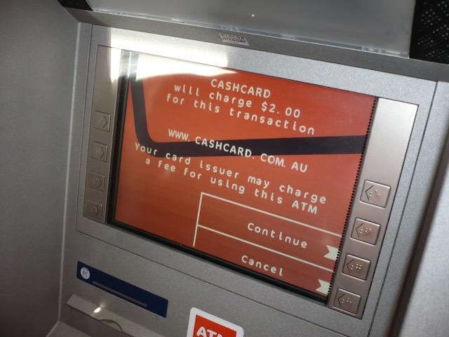 ATM showing transaction fee message